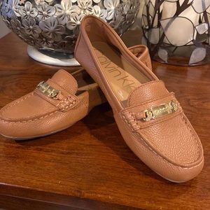 Calvin Klein tan ladies flats with gold detail on front. Leather uppers.